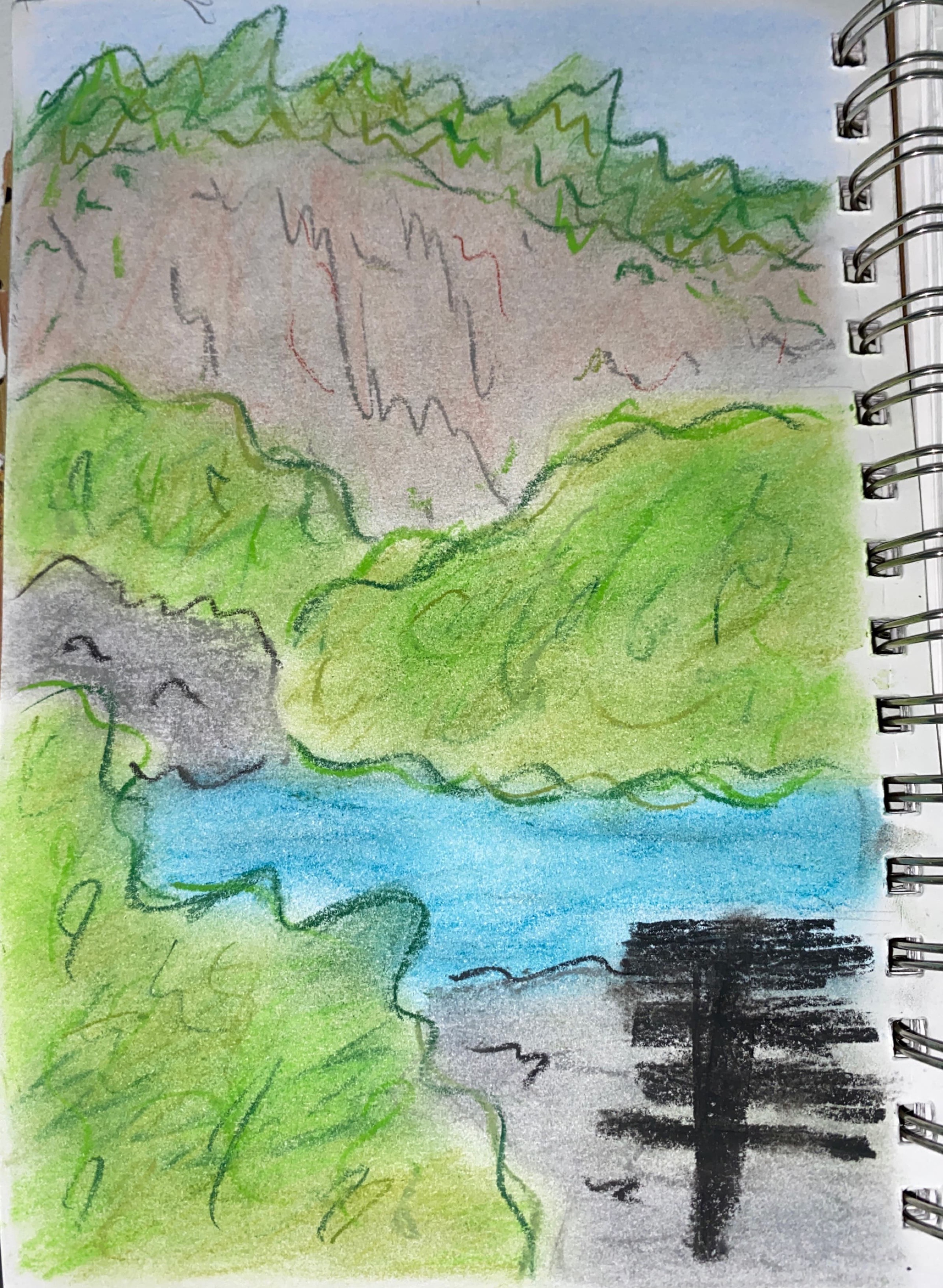 a pastel drawing of a bench in front of a lake. across the lake there is a cliff